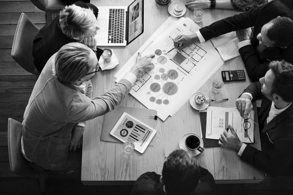 Aerial view business people brainstorming together scaled